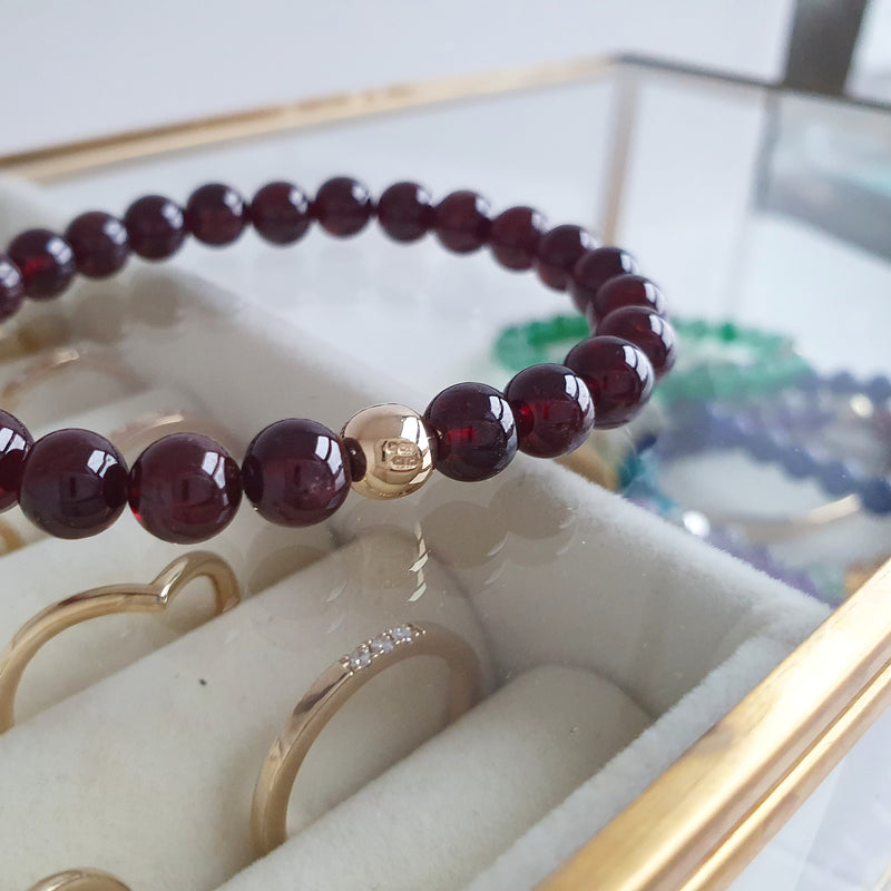 Gemstone bracelets with solid gold bead